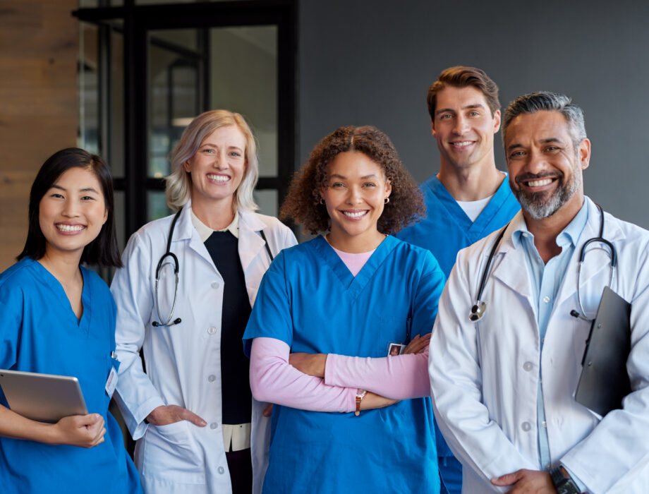 Group of diverse skilled nursing and healthcare professionals smiling, representing the care team behind skilled nursing services